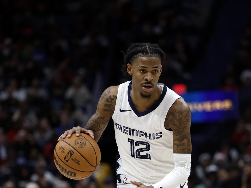 NEW ORLEANS, LOUISIANA - DECEMBER 19: Ja Morant #12 of the Memphis Grizzlies drives the ball up the court against the New Orleans Pelicans at Smoothie King Center on December 19, 2023 in New Orleans, Louisiana.  NOTE TO USER: User expressly acknowledges and agrees that, by downloading and or using this photograph, User is consenting to the terms and conditions of the Getty Images License Agreement. (Photo by Chris Graythen/Getty Images)