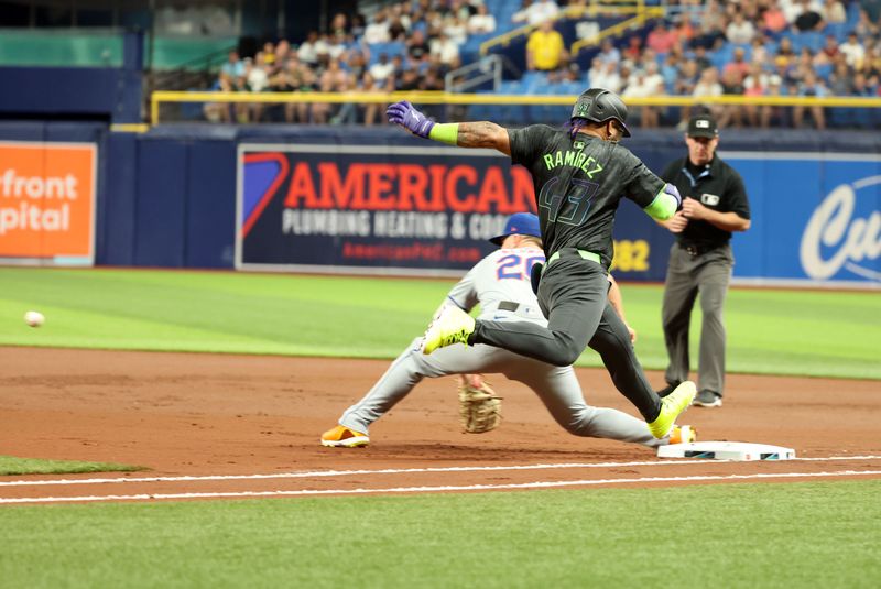 May 3, 2024; St. Petersburg, Florida, USA;  Tampa Bay Rays outfielder Harold Ramírez (43) is safe at first base as New York Mets first base Pete Alonso (20) attempted to tag him out during the first inning at Tropicana Field. Mandatory Credit: Kim Klement Neitzel-USA TODAY Sports