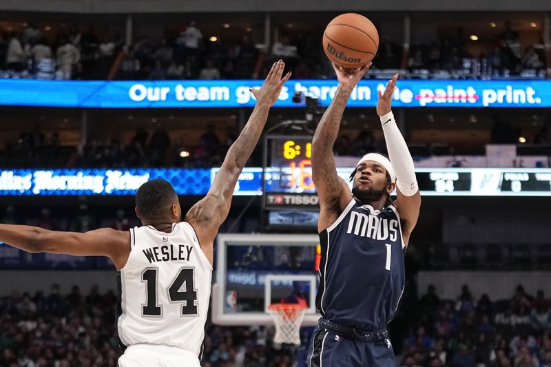 DALLAS, TEXAS - DECEMBER 23: Jaden Hardy #1 of the Dallas Mavericks shoots as Blake Wesley #14 of the San Antonio Spurs defends during the second half at American Airlines Center on December 23, 2023 in Dallas, Texas. NOTE TO USER: User expressly acknowledges and agrees that, by downloading and or using this photograph, User is consenting to the terms and conditions of the Getty Images License Agreement. (Photo by Sam Hodde/Getty Images)