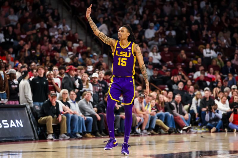 Feb 17, 2024; Columbia, South Carolina, USA; LSU Tigers forward Tyrell Ward (15) celebrates a three point basket against the South Carolina Gamecocks in the second half at Colonial Life Arena. Mandatory Credit: Jeff Blake-USA TODAY Sports