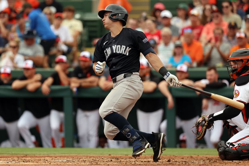 Mar 2, 2024; Sarasota, Florida, USA; New York Yankees shortstop Anthony Volpe (11) singles during the third inning against the Baltimore Orioles at Ed Smith Stadium. Mandatory Credit: Kim Klement Neitzel-USA TODAY Sports