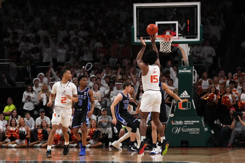 Feb 6, 2023; Coral Gables, Florida, USA; Miami Hurricanes forward Norchad Omier (15) attempts a three point shot against the Duke Blue Devils during the first half at Watsco Center. Mandatory Credit: Jasen Vinlove-USA TODAY Sports