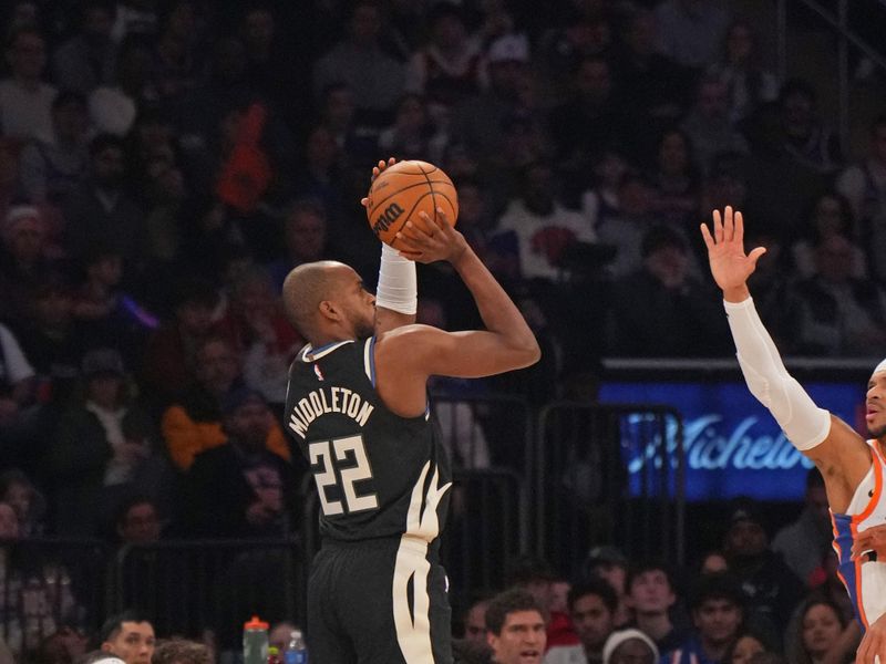 NEW YORK, NY - JANUARY 12: Khris Middleton #22 of the Milwaukee Bucks shoots a three point basket during the game against the New York Knicks on January 12, 2025 at Madison Square Garden in New York City, New York.  NOTE TO USER: User expressly acknowledges and agrees that, by downloading and or using this photograph, User is consenting to the terms and conditions of the Getty Images License Agreement. Mandatory Copyright Notice: Copyright 2025 NBAE  (Photo by Jesse D. Garrabrant/NBAE via Getty Images)