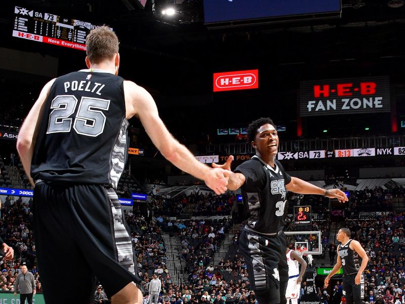 SAN ANTONIO, TX - DECEMBER 29: Jakob Poeltl #25 of the San Antonio Spurs high fives Stanley Johnson #34 of the San Antonio Spurs during the game against the New York Knicks on December 29, 2022 at the AT&T Center in San Antonio, Texas. NOTE TO USER: User expressly acknowledges and agrees that, by downloading and or using this photograph, user is consenting to the terms and conditions of the Getty Images License Agreement. Mandatory Copyright Notice: Copyright 2022 NBAE (Photos by Michael Gonzales/NBAE via Getty Images)