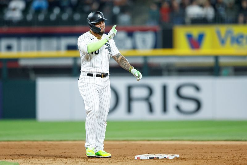 May 13, 2023; Chicago, Illinois, USA; Chicago White Sox third baseman Yoan Moncada (10) celebrates after hitting a double against the Houston Astros during the eighth inning at Guaranteed Rate Field. Mandatory Credit: Kamil Krzaczynski-USA TODAY Sports