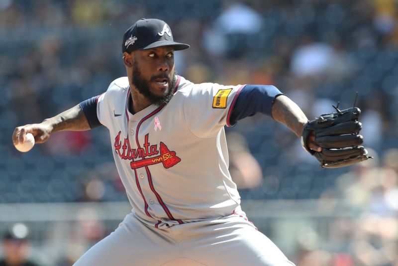 May 11, 2025; Pittsburgh, Pennsylvania, USA;  Atlanta Braves relief pitcher Enyel De Los Santos (61) pitches against the Pittsburgh Pirates during the seventh inning at PNC Park. Mandatory Credit: Charles LeClaire-Imagn Images