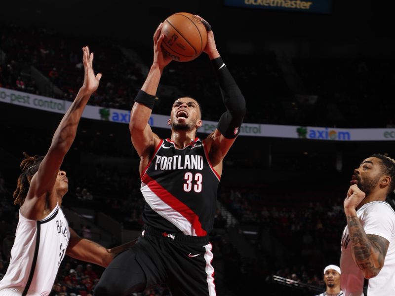 PORTLAND, OR - JANUARY 14: Toumani Camara #33 of the Portland Trail Blazers drives to the basket during the game against the Brooklyn Nets on January 14, 2025 at the Moda Center Arena in Portland, Oregon. NOTE TO USER: User expressly acknowledges and agrees that, by downloading and or using this photograph, user is consenting to the terms and conditions of the Getty Images License Agreement. Mandatory Copyright Notice: Copyright 2025 NBAE (Photo by Cameron Browne/NBAE via Getty Images)