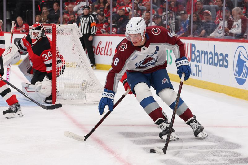 Oct 26, 2025; Newark, New Jersey, USA; Colorado Avalanche defenseman Cale Makar (8) skates with the puck against the Colorado Avalanche during the first period at Prudential Center. Mandatory Credit: Ed Mulholland-Imagn Images