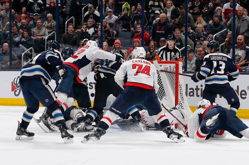 Dec 21, 2023; Columbus, Ohio, USA; Washington Capitals goalie Charlie Lindgren (79) makes a save as Columbus Blue Jackets right wing Justin Danforth (17) looks for a rebound during the third period at Nationwide Arena. Mandatory Credit: Russell LaBounty-USA TODAY Sports