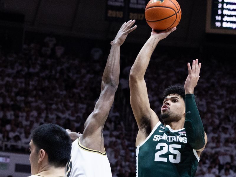 Jan 29, 2023; West Lafayette, Indiana, USA; Michigan State Spartans forward Malik Hall (25)  shoots the ball while  Purdue Boilermakers guard Brandon Newman (5) defends in the first half at Mackey Arena. Mandatory Credit: Trevor Ruszkowski-USA TODAY Sports