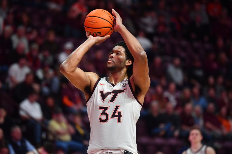 Jan 27, 2024; Blacksburg, Virginia, USA; Virginia Tech Hokies forward Mylyjael Poteat (34) shoots a technical foul shot during the second half at Cassell Coliseum. Mandatory Credit: Brian Bishop-USA TODAY Sports