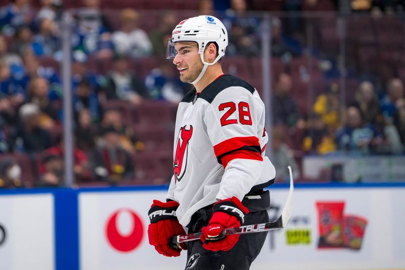 Oct 30, 2024; Vancouver, British Columbia, CAN; New Jersey Devils forward Timo Meier (28) smiles during a stop in play against the Vancouver Canucks during the third period at Rogers Arena. Mandatory Credit: Bob Frid-Imagn Images