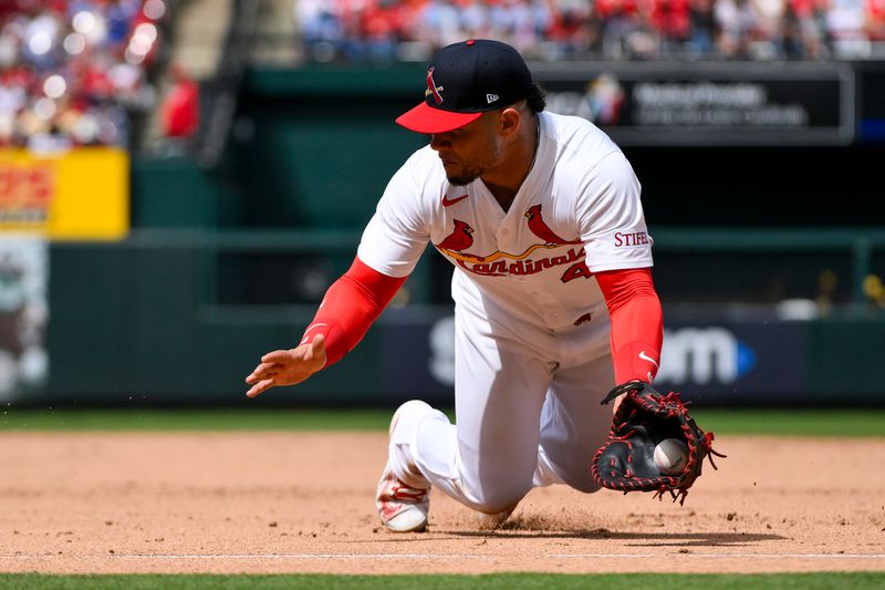 Apr 27, 2025; St. Louis, Missouri, USA;  St. Louis Cardinals first baseman Willson Contreras (40) dives and fields a ground ball hit by Milwaukee Brewers second baseman Brice Turang (not pictured) during the sixth inning at Busch Stadium. Mandatory Credit: Jeff Curry-Imagn Images
