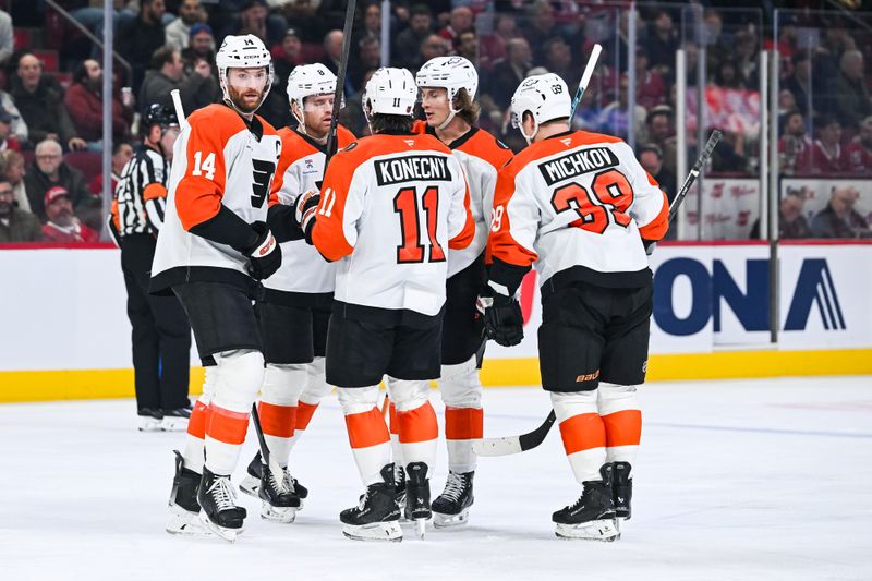 Nov 4, 2025; Montreal, Quebec, CAN; Philadelphia Flyers defenseman Cam York (8) celebrates his first goal of the game against the Montreal Canadiens with his teammates during the first period at Bell Centre. Mandatory Credit: David Kirouac-Imagn Images
