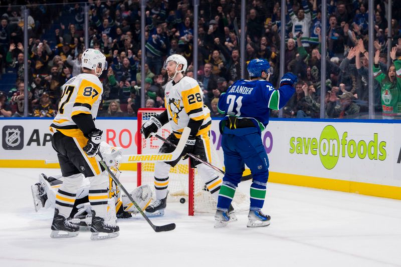 Feb 27, 2024; Vancouver, British Columbia, CAN; Pittsburgh Penguins forward Sidney Crosby (87) and defenseman Marcus Pettersson (28) watch as Vancouver Canucks forward Nils Hoglander (21) celebrates his goal scored on goalie Tristan Jarry (35) in the first period at Rogers Arena. Mandatory Credit: Bob Frid-USA TODAY Sports