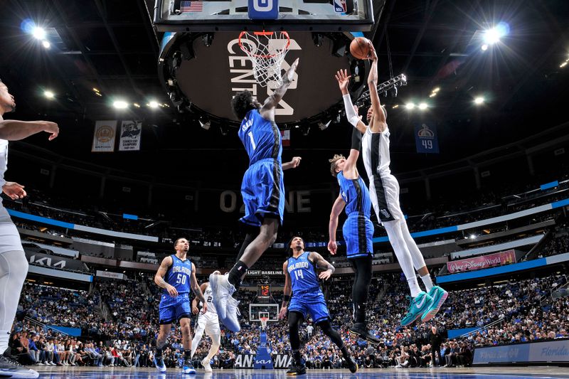 ORLANDO, FL - FEBRUARY 8: Jonathan Isaac #1 of the Orlando Magic block during the game against the San Antonio Spurs on February 8, 2024 at the Kia Center in Orlando, Florida. NOTE TO USER: User expressly acknowledges and agrees that, by downloading and or using this photograph, User is consenting to the terms and conditions of the Getty Images License Agreement. Mandatory Copyright Notice: Copyright 2024 NBAE (Photo by Fernando Medina/NBAE via Getty Images)