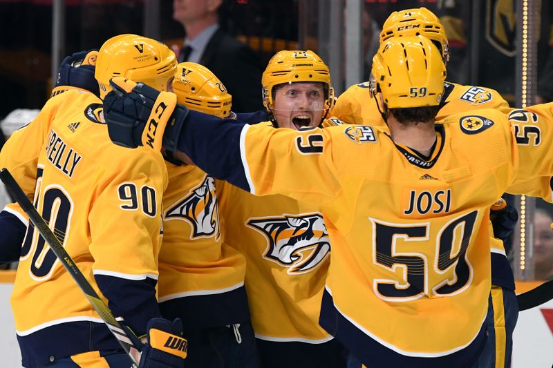 Mar 26, 2024; Nashville, Tennessee, USA; Nashville Predators center Gustav Nyquist (14) celebrates with teammates after a goal during the third period against the Vegas Golden Knights at Bridgestone Arena. Mandatory Credit: Christopher Hanewinckel-USA TODAY Sports