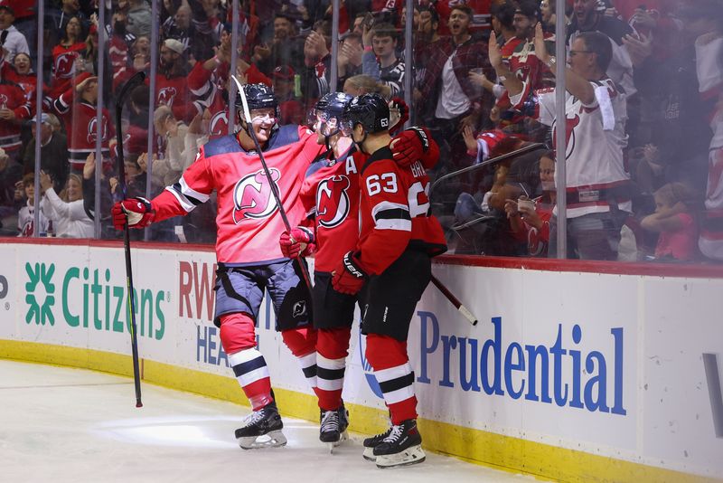 Oct 13, 2023; Newark, New Jersey, USA; New Jersey Devils left wing Jesper Bratt (63) celebrates his goal against the Arizona Coyotes during the second period at Prudential Center. Mandatory Credit: Ed Mulholland-USA TODAY Sports