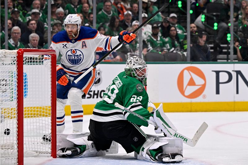 May 21, 2025; Dallas, Texas, USA;Edmonton Oilers center Leon Draisaitl (29) scores a goal against Dallas Stars goaltender Jake Oettinger (29) in the first period during game one of the Western Conference Final of the 2025 Stanley Cup Playoffs at American Airlines Center. Mandatory Credit: Jerome Miron-Imagn Images