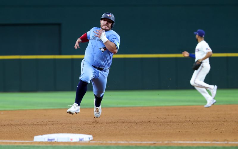 Sep 18, 2024; Arlington, Texas, USA;  Toronto Blue Jays catcher Alejandro Kirk (30) runs to third base during the fifth inning against the Texas Rangers at Globe Life Field. Mandatory Credit: Kevin Jairaj-Imagn Images