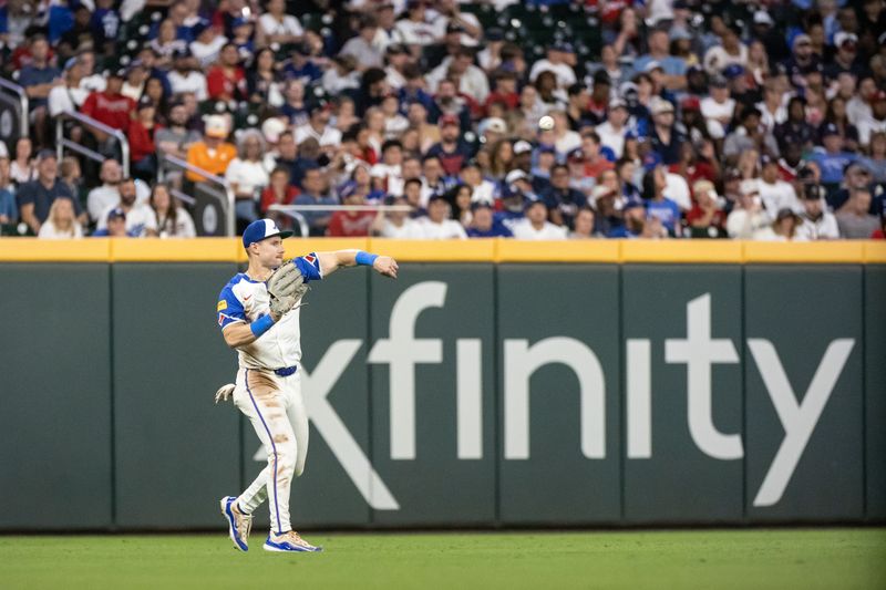 Sep 14, 2024; Cumberland, Georgia, USA; Atlanta Braves outfielder Jarred Kelenic (24) throws the ball infield during the game against the Los Angeles Dodgers during the seventh inning at Truist Park. Mandatory Credit: Jordan Godfree-Imagn Images