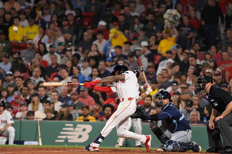 May 14, 2024; Boston, Massachusetts, USA; Boston Red Sox shortstop Ceddanne Rafaela (43) hits a home run against the Tampa Bay Rays during the fifth inning at Fenway Park. Mandatory Credit: Eric Canha-USA TODAY Sports