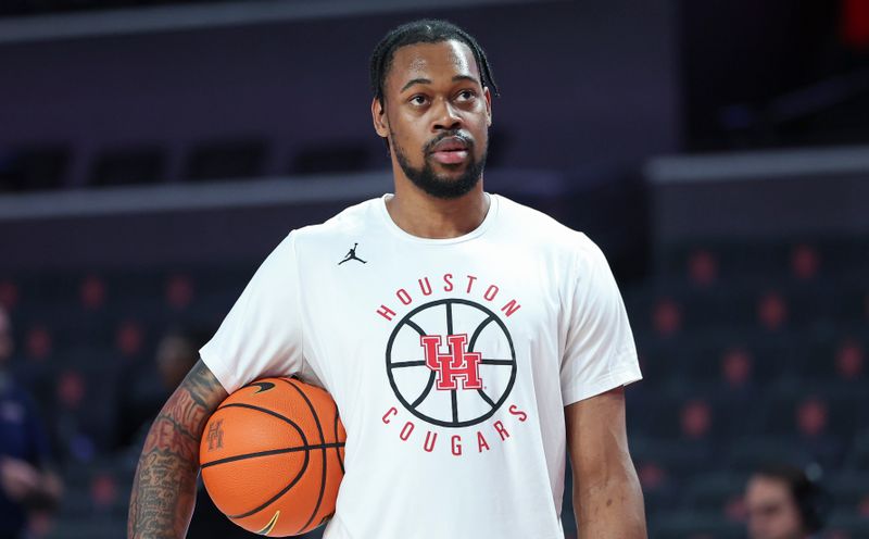 Feb 19, 2024; Houston, Texas, USA; Houston Cougars forward J'Wan Roberts (13) warms up before the game against the Iowa State Cyclones at Fertitta Center. Mandatory Credit: Troy Taormina-USA TODAY Sports