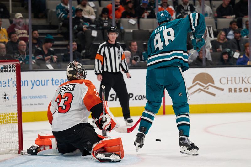 Nov 7, 2023; San Jose, California, USA; San Jose Sharks center Tomas Hertl (48) tries to deflect a shot on goal against Philadelphia Flyers goaltender Samuel Ersson (33) during the second period at SAP Center at San Jose. Mandatory Credit: Robert Edwards-USA TODAY Sports