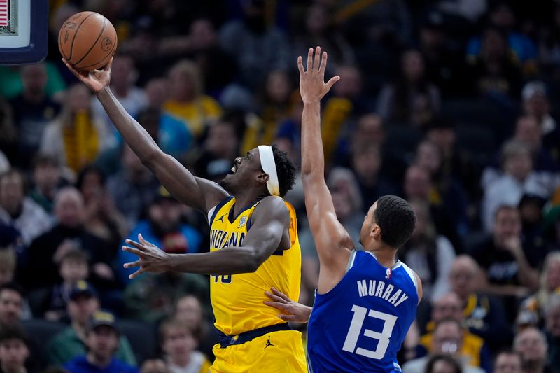 INDIANAPOLIS, INDIANA - FEBRUARY 02: Pascal Siakam #43 of the Indiana Pacers attempts a layup while being guarded by Keegan Murray #13 of the Sacramento Kings in the first quarter at Gainbridge Fieldhouse on February 02, 2024 in Indianapolis, Indiana. NOTE TO USER: User expressly acknowledges and agrees that, by downloading and or using this photograph, User is consenting to the terms and conditions of the Getty Images License Agreement. (Photo by Dylan Buell/Getty Images)