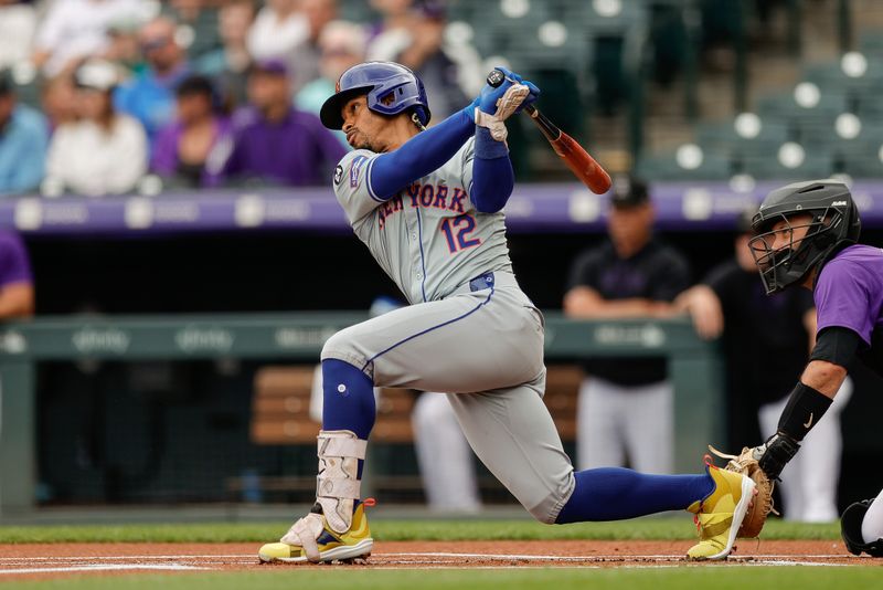 Aug 8, 2024; Denver, Colorado, USA; New York Mets shortstop Francisco Lindor (12) hits a double in the first inning against the Colorado Rockies at Coors Field. Mandatory Credit: Isaiah J. Downing-USA TODAY Sports