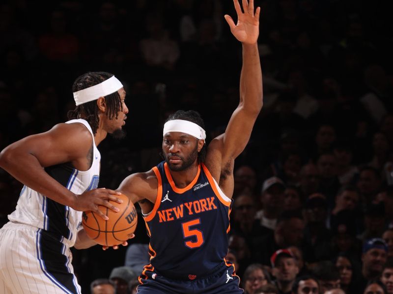 NEW YORK, NY - JANUARY 6:  Precious Achiuwa #5 of the New York Knicks plays defense during the game against the Orlando Magic on January 6, 2025 at Madison Square Garden in New York City, New York.  NOTE TO USER: User expressly acknowledges and agrees that, by downloading and or using this photograph, User is consenting to the terms and conditions of the Getty Images License Agreement. Mandatory Copyright Notice: Copyright 2025 NBAE  (Photo by Nathaniel S. Butler/NBAE via Getty Images)