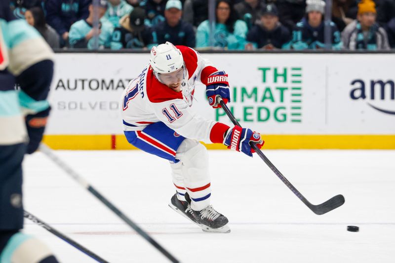 Mar 24, 2024; Seattle, Washington, USA; Montreal Canadiens right wing Brendan Gallagher (11) passes the puck against the Seattle Kraken during the second period at Climate Pledge Arena. Mandatory Credit: Joe Nicholson-USA TODAY Sports