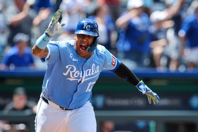 Jun 26, 2024; Kansas City, Missouri, USA; Kansas City Royals catcher Salvador Perez (13) reacts after hitting a two RBI double against the Miami Marlins during the eighth inning at Kauffman Stadium. Mandatory Credit: William Purnell-USA TODAY Sports