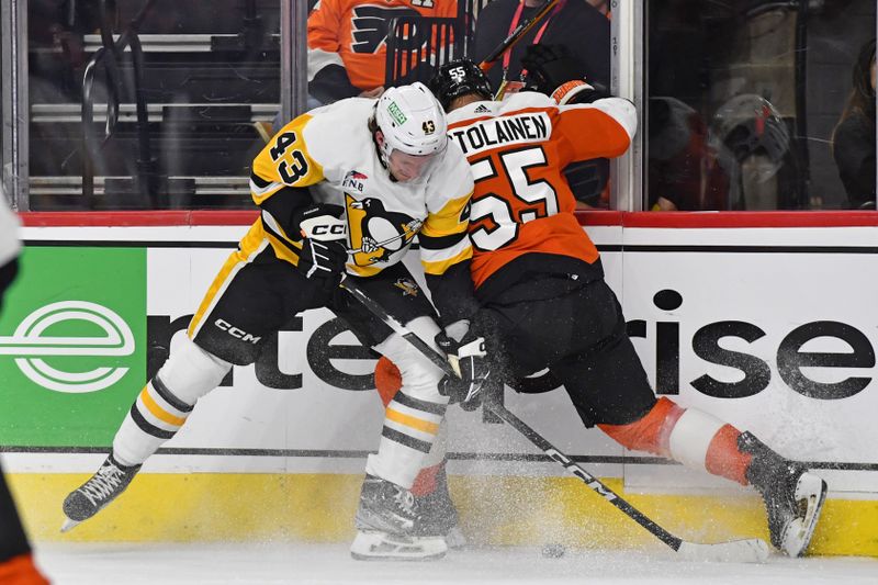 Jan 8, 2024; Philadelphia, Pennsylvania, USA; Pittsburgh Penguins center Jansen Harkins (43) and Philadelphia Flyers defenseman Rasmus Ristolainen (55) battle for the puck during the second period at Wells Fargo Center. Mandatory Credit: Eric Hartline-USA TODAY Sports