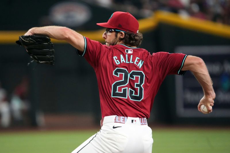 Jul 14, 2024; Phoenix, Arizona, USA; Arizona Diamondbacks pitcher Zac Gallen (23) pitches against the Toronto Blue Jays during the first inning at Chase Field. Mandatory Credit: Joe Camporeale-USA TODAY Sports