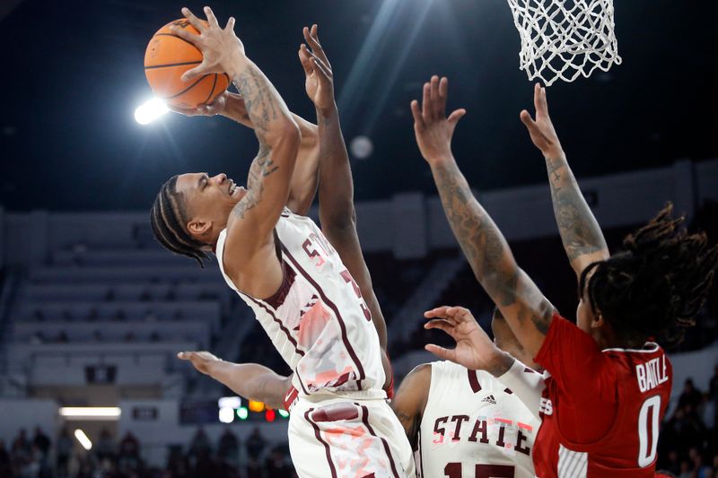 Feb 17, 2024; Starkville, Mississippi, USA; Mississippi State Bulldogs guard Shakeel Moore (3) shoots the ball against the Arkansas Razorbacks during the first half at Humphrey Coliseum. Mandatory Credit: Petre Thomas-USA TODAY Sports