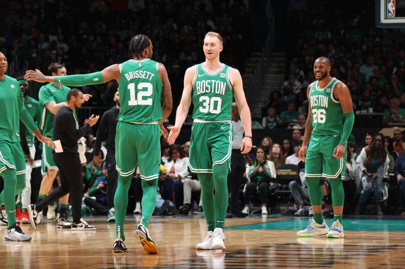 WASHINGTON, DC -? MARCH 17: Sam Hauser #30 high fives Oshae Brissett #12 of the Boston Celtics during the game against the Washington Wizards on March 17, 2024 at Capital One Arena in Washington, DC. NOTE TO USER: User expressly acknowledges and agrees that, by downloading and or using this Photograph, user is consenting to the terms and conditions of the Getty Images License Agreement. Mandatory Copyright Notice: Copyright 2024 NBAE (Photo by Stephen Gosling/NBAE via Getty Images)