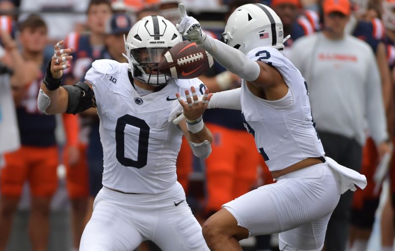 Sep 16, 2023; Champaign, Illinois, USA;  Penn State Nittany Lions linebacker Dominic DeLuca (0) and safety Keaton Ellis (2) break up a pass against the Illinois Fighting Illini during the second half at Memorial Stadium. Mandatory Credit: Ron Johnson-USA TODAY Sports