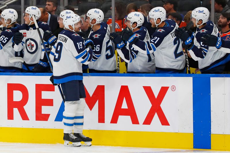 Sep 22, 2024; Edmonton, Alberta, CAN; The Winnipeg Jets celebrate a goal scored by Winnipeg Jets forward David Gustafson (19) during the first period against the Edmonton Oilers at Rogers Place. Mandatory Credit: Perry Nelson-Imagn Images