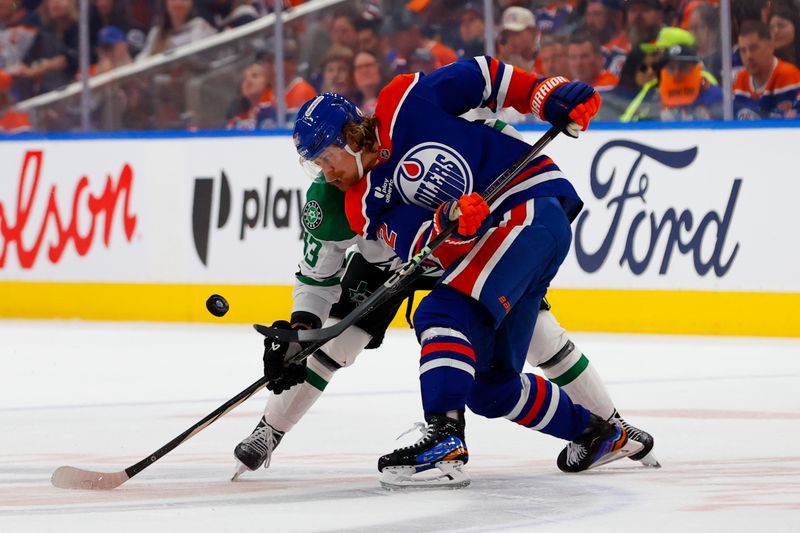 May 25, 2025; Edmonton, Alberta, CAN; Dallas Stars center Wyatt Johnston (53) and Edmonton Oilers right wing Kasperi Kapanen (42) take the face-off during the second period in game three of the Western Conference Final of the 2025 Stanley Cup Playoffs at Rogers Place. Mandatory Credit: Perry Nelson-Imagn Images