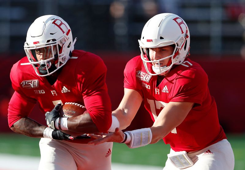 Oct 19, 2019; Piscataway, NJ, USA; Rutgers Scarlet Knights quarterback Johnny Langan (17) hands off the ball to Rutgers Scarlet Knights running back Isaih Pacheco (1) during the first half at SHI Stadium. Mandatory Credit: Noah K. Murray-USA TODAY Sports