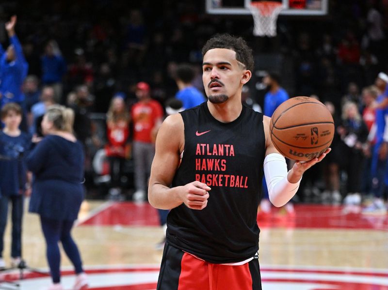 ATLANTA, GEORGIA - JANUARY 26:  Trae Young #11 of the Atlanta Hawks warms up before the game against the Dallas Mavericks on January 26, 2024 at State Farm Arena in Atlanta, Georgia.NOTE TO USER: User expressly acknowledges and agrees that, by downloading and or using this photograph, User is consenting to the terms and conditions of the Getty Images License Agreement. (Photo by Paras Griffin/Getty Images)