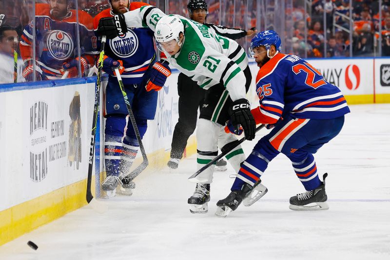 Jun 2, 2024; Edmonton, Alberta, CAN; Edmonton Oilers defensemen Darnell Nurse (25) and Dallas Stars forward Jason Robertson (21) Battle along the boards for a loose puck  during the second period in game six of the Western Conference Final of the 2024 Stanley Cup Playoffs at Rogers Place. Mandatory Credit: Perry Nelson-USA TODAY Sports