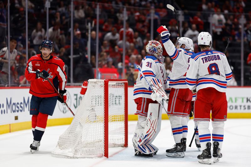 Apr 28, 2024; Washington, District of Columbia, USA; New York Rangers goaltender Igor Shesterkin (31) celebrates with teammates after the final horn as Washington Capitals center Dylan Strome (17) skates away in game four of the first round of the 2024 Stanley Cup Playoffs at Capital One Arena. Mandatory Credit: Geoff Burke-USA TODAY Sports