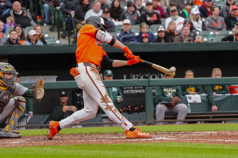Apr 27, 2024; Baltimore, Maryland, USA; Baltimore Orioles shortstop Gunnar Henderson (2) hits a two run home run against the Oakland Athletics during the seventh inning at Oriole Park at Camden Yards. Mandatory Credit: Gregory Fisher-USA TODAY Sports