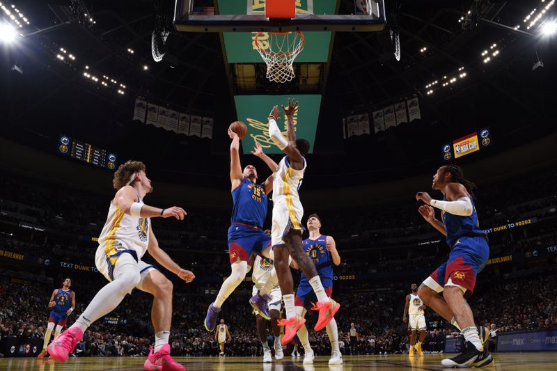 DENVER, CO - DECEMBER 3: Nikola Jokic #15 of the Denver Nuggets drives to the basket during the game against the Golden State Warriors during the Emirates NBA Cup on December 3, 2024 at Ball Arena in Denver, Colorado. NOTE TO USER: User expressly acknowledges and agrees that, by downloading and/or using this Photograph, user is consenting to the terms and conditions of the Getty Images License Agreement. Mandatory Copyright Notice: Copyright 2024 NBAE (Photo by Garrett Ellwood/NBAE via Getty Images)