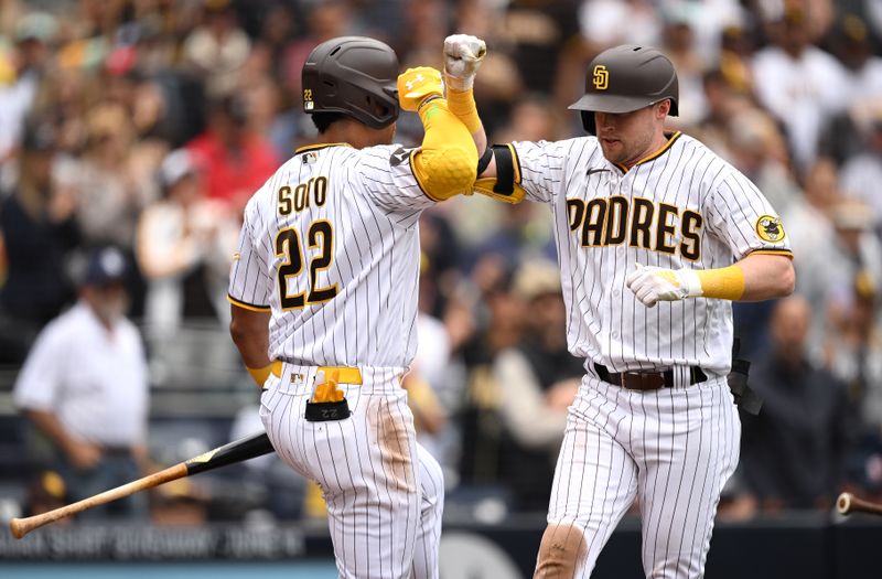 May 17, 2023; San Diego, California, USA; San Diego Padres first baseman Jake Cronenworth (right) is congratulated by left fielder Juan Soto (22) after hitting a home run during the fifth inning against the Kansas City Royals at Petco Park. Mandatory Credit: Orlando Ramirez-USA TODAY Sports