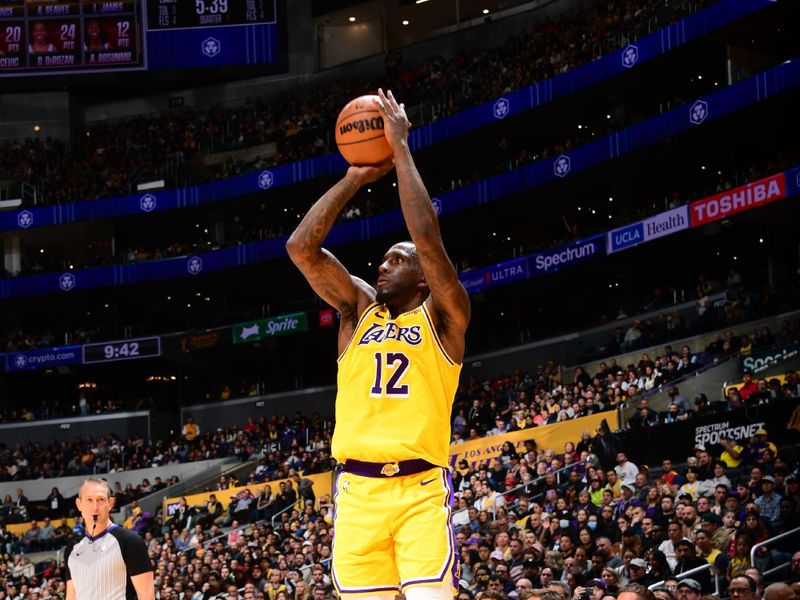 LOS ANGELES, CA - JANUARY 25: Taurean Prince #12 of the Los Angeles Lakers shoots a three point basket during the game against the Chicago Bulls on January 25, 2024 at Crypto.Com Arena in Los Angeles, California. NOTE TO USER: User expressly acknowledges and agrees that, by downloading and/or using this Photograph, user is consenting to the terms and conditions of the Getty Images License Agreement. Mandatory Copyright Notice: Copyright 2024 NBAE (Photo by Adam Pantozzi/NBAE via Getty Images)