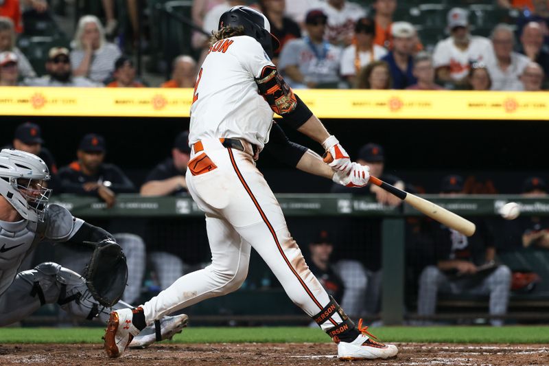 Jun 10, 2025; Baltimore, Maryland, USA; Baltimore Orioles shortstop Gunnar Henderson (2) hits a double during the eighth inning against the Detroit Tigers at Oriole Park at Camden Yards. Mandatory Credit: Daniel Kucin Jr.-Imagn Images
