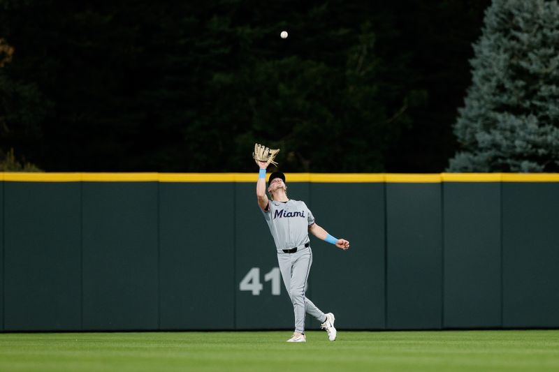 Aug 27, 2024; Denver, Colorado, USA; Miami Marlins center fielder Kyle Stowers (28) makes a catch in the fourth inning against the Colorado Rockies at Coors Field. Mandatory Credit: Isaiah J. Downing-USA TODAY Sports